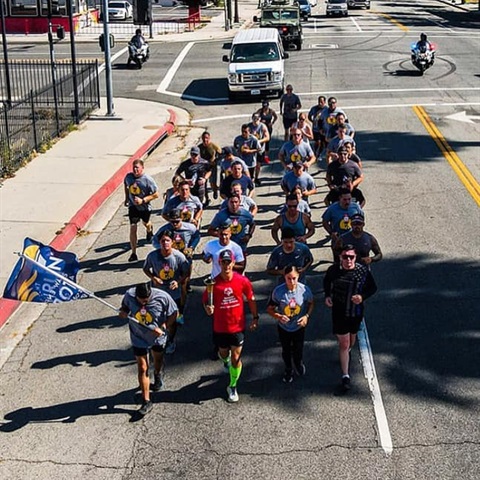 Runners completing a torch run to support Special Olympics athletes